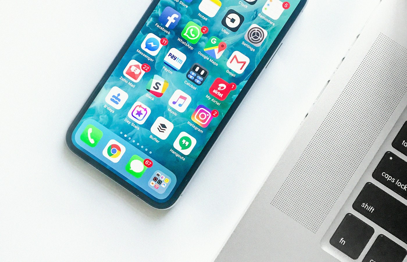 A phone and charging cable on a desk